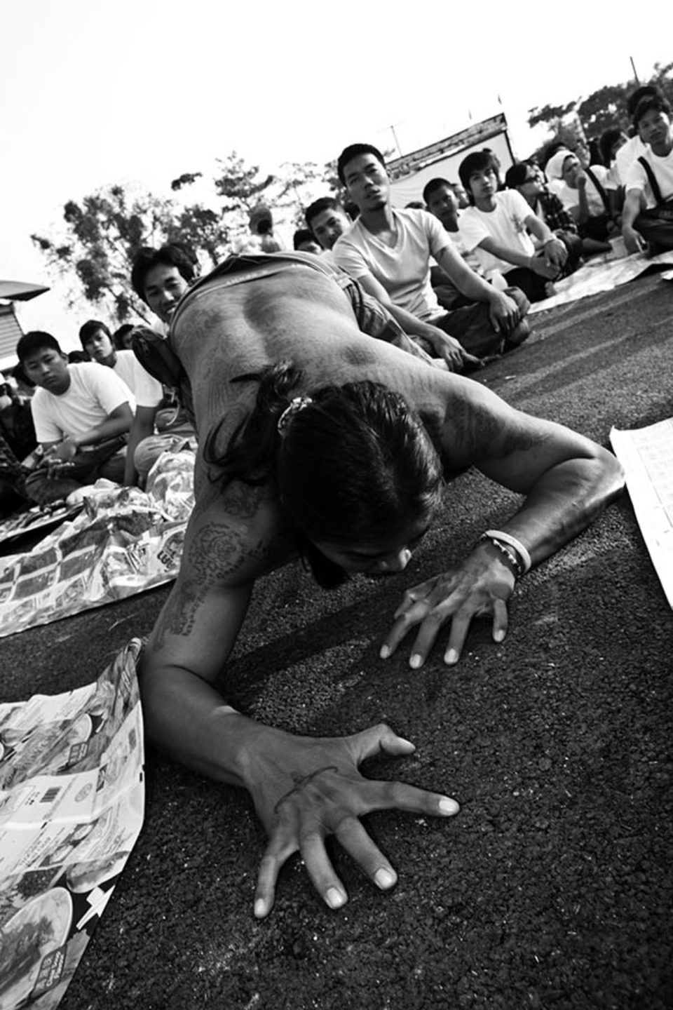 Celebrant in a trance crawls on the ground