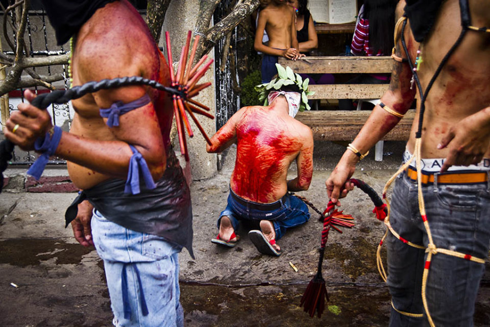 Celebrants purifying themselves in street