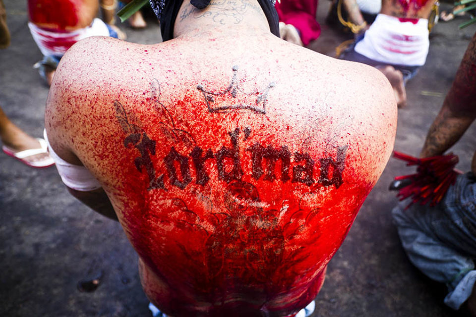 Blood-covered back tattoo