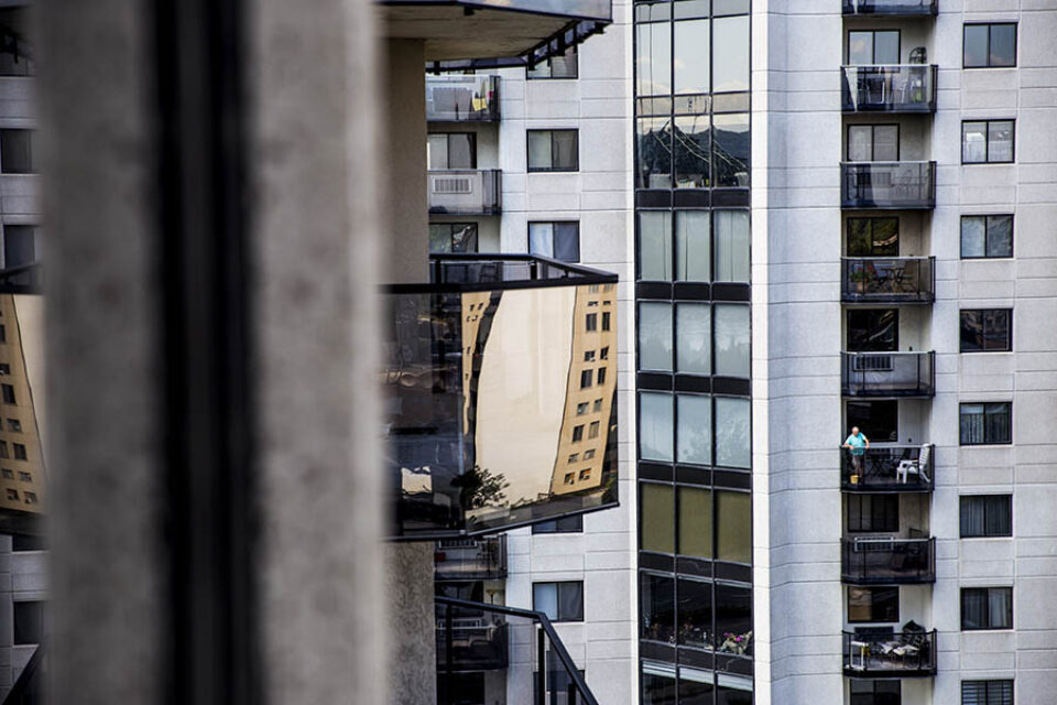 Man on condominium balcony