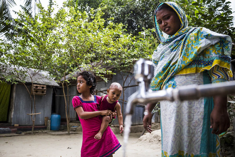 Woman using tap water