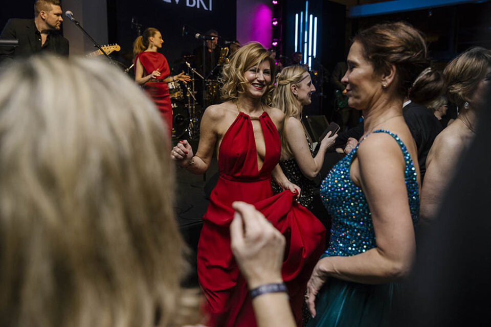 Women in ballgowns dancing