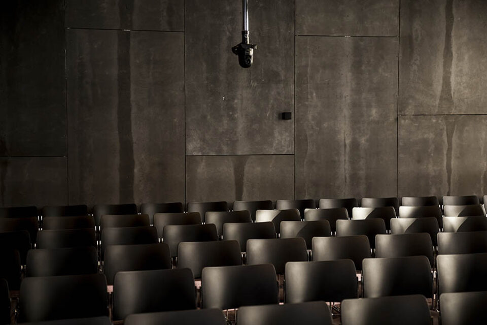 Rows of chairs set up in conference room