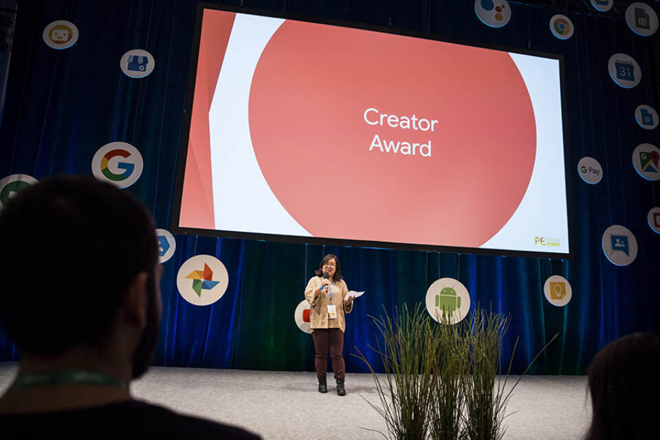 Presenter giving award onstage