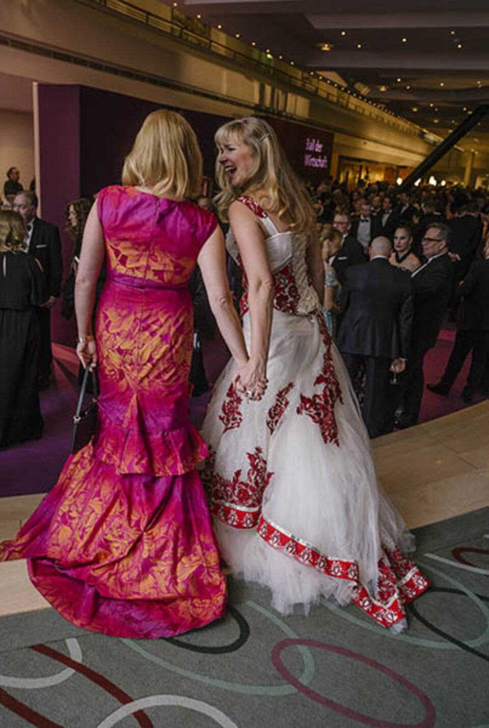 Women in colourful ballgowns