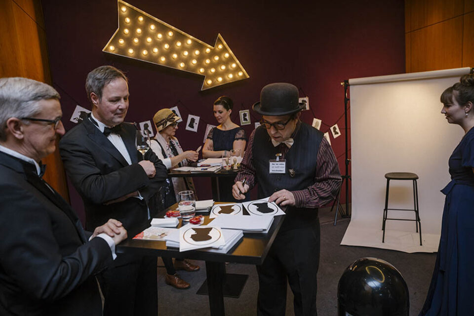 Paper artist in studio at event