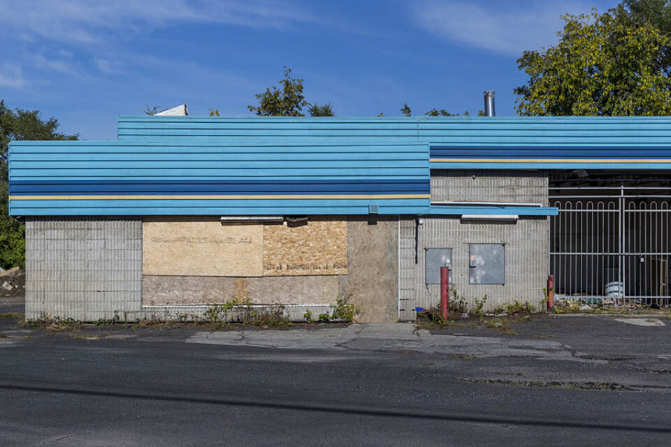 Abandoned blue building facade