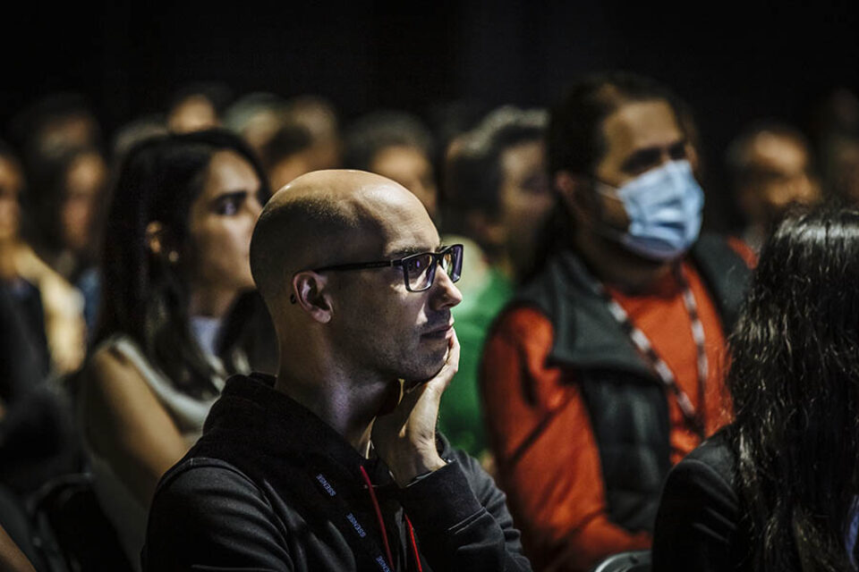 Event audience member concentrating