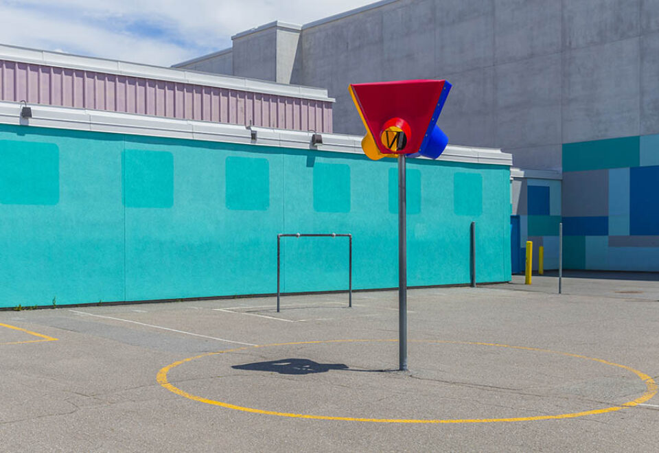 Goalposts and basketball net in playground