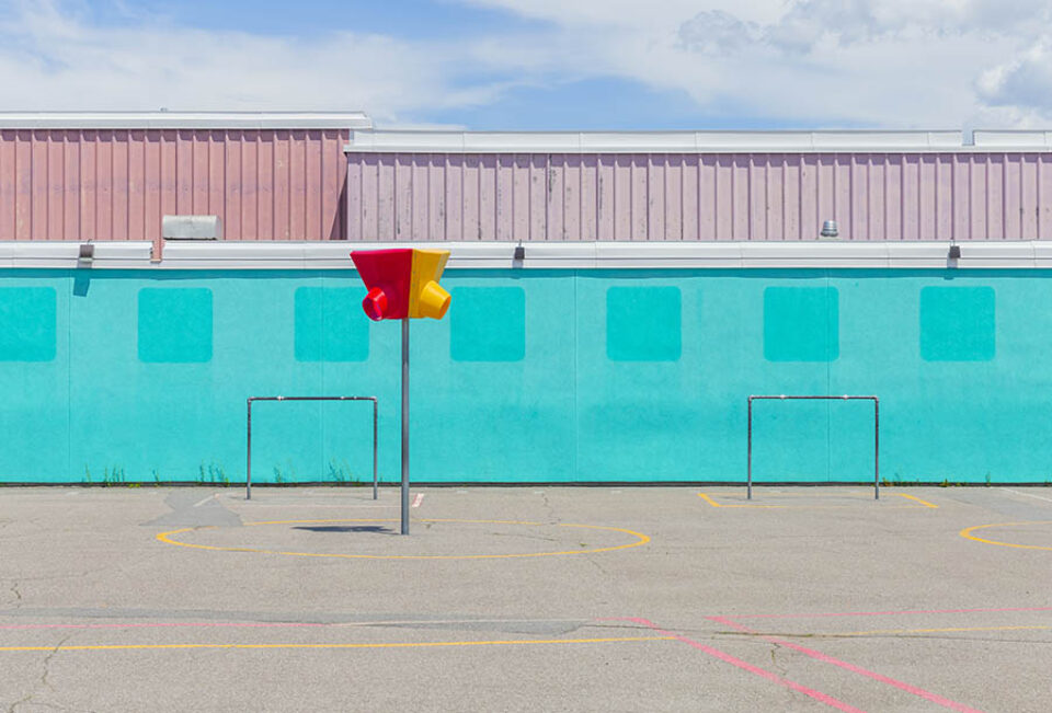 Goalposts and basketball net in playground