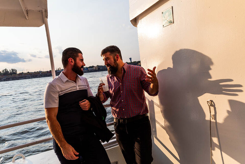 People talking at event on boat